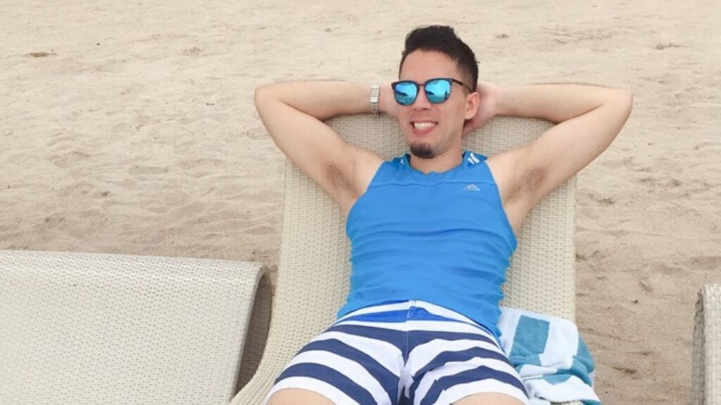 Billy on a sun lounger on the sand