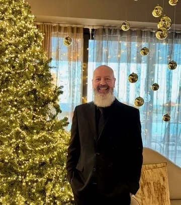 Tony in black smiling